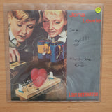Jona Lewie – Love Detonator - Vinyl 7" Record - Very-Good+ Quality (VG+) (verygoodplus7)