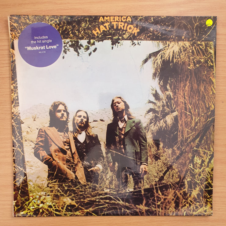 America – Hat Trick - Vinyl LP Record - Very-Good+ Quality (VG+)