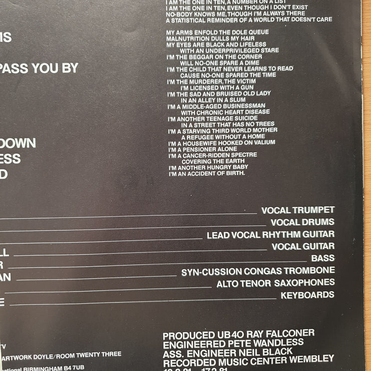 UB40 – Present Arms - (includes additional 45 RPM record) - Vinyl LP Record - Very-Good+ Quality (VG+)