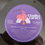 Stimela – Trouble In The Land Of The Plenty - Vinyl LP Record - Very-Good Quality (VG)  (verry)