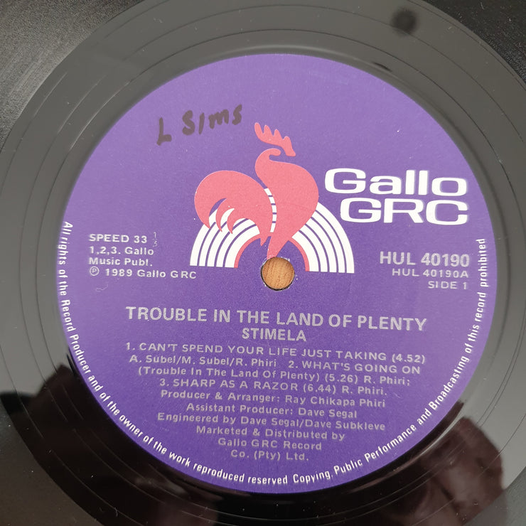 Stimela – Trouble In The Land Of The Plenty - Vinyl LP Record - Very-Good Quality (VG)  (verry)