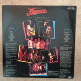 America ‎– America In Concert - Vinyl LP Record - Opened  - Very-Good Quality (VG) - C-Plan Audio