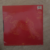 Dan Reed Network - Tiger In A Dress -  Vinyl LP - Opened  - Very-Good+ Quality (VG+) - C-Plan Audio