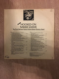 Also Hooked on Sakkie Sakkie - Vinyl LP Record - Opened  - Very-Good+ Quality (VG+) - C-Plan Audio